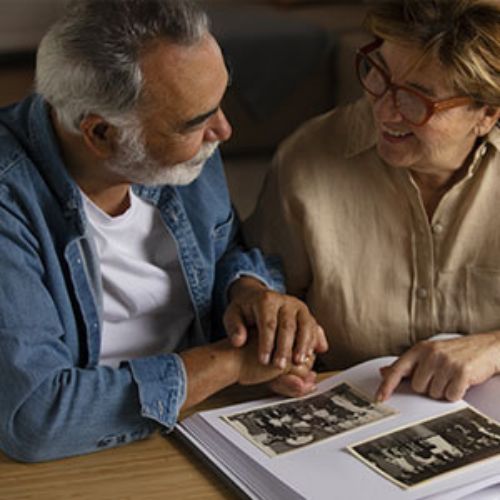 Elderly couple discussing health tips for staying healthy as we age.