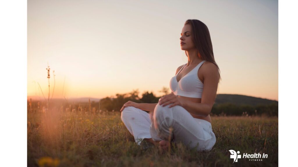 Woman meditating outdoors for mindfulness and stress relief"