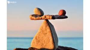 Well-balanced rocks on a beach, symbolizing harmony and the importance of wellness & health in life