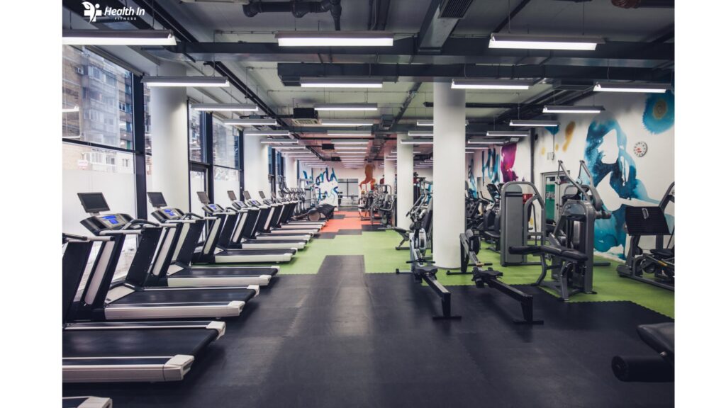 Interior of a fitness gym filled with modern equipment, highlighting the variety of tools available for effective workouts."