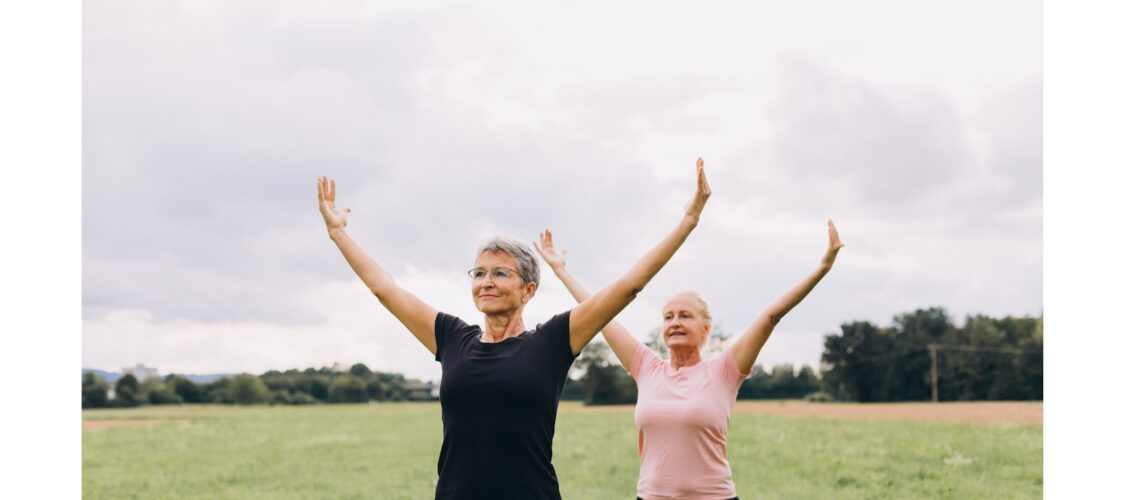 An older man and woman exercising outdoors, showcasing the benefits of exercise for all ages.